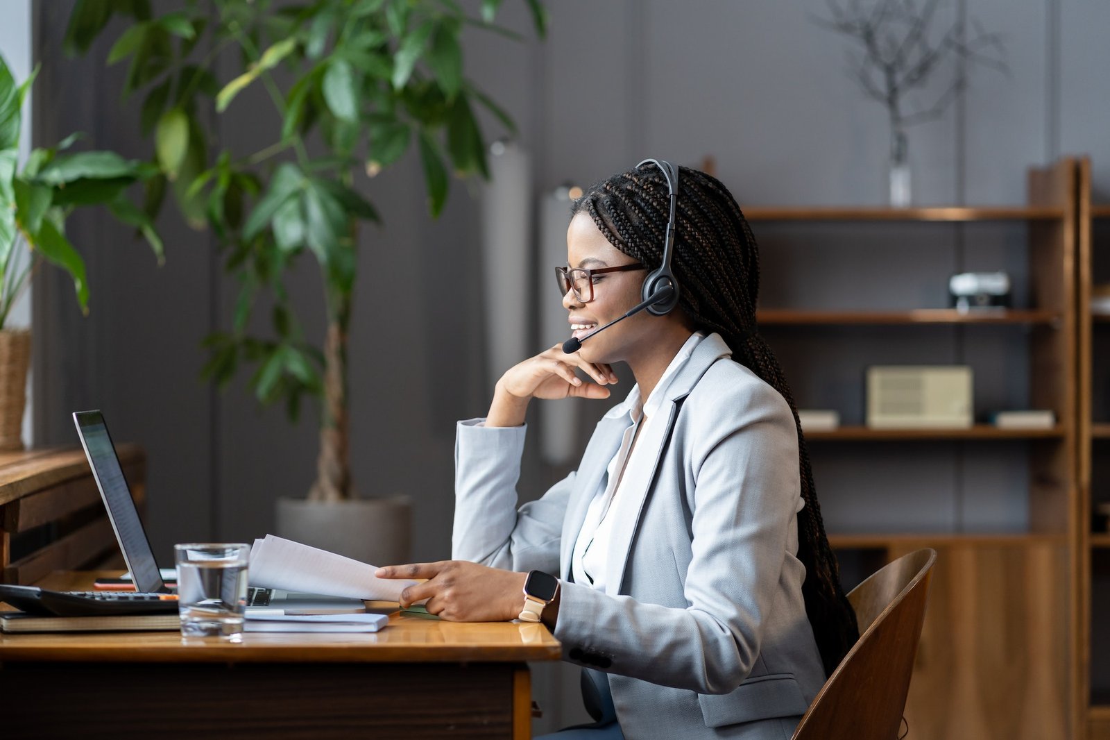 young-positive-african-woman-remote-recruiter-using-wireless-headset-to-communicate-with-candidates.jpg